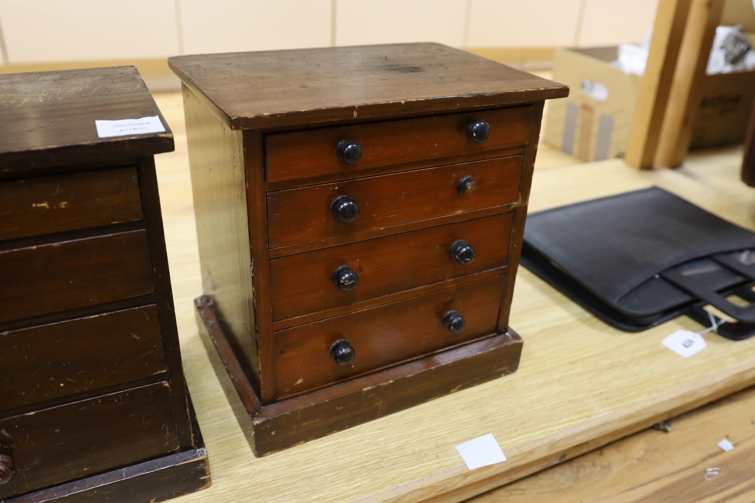 Three miniature four drawer collector's chests, tallest 33cms high